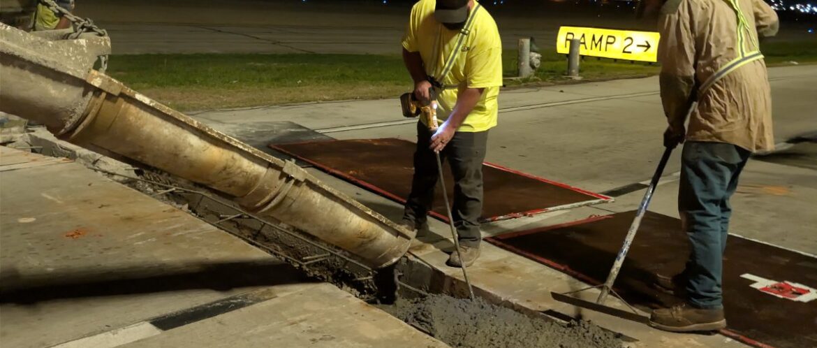 Quick Mix Concrete crew pouring a nighttime concrete repair at Hartsfield-Jackson Atlanta International Airport from the mobile mixer chute