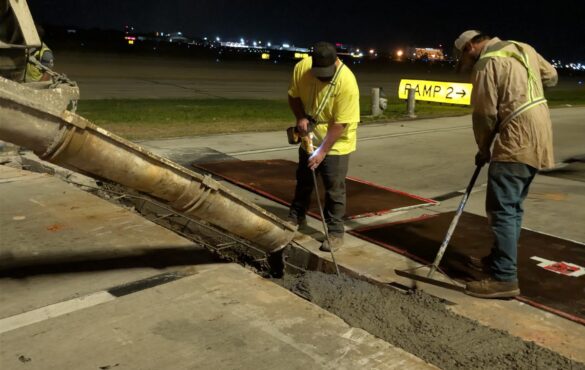 Quick Mix Concrete crew pouring a nighttime concrete repair at Hartsfield-Jackson Atlanta International Airport from the mobile mixer chute
