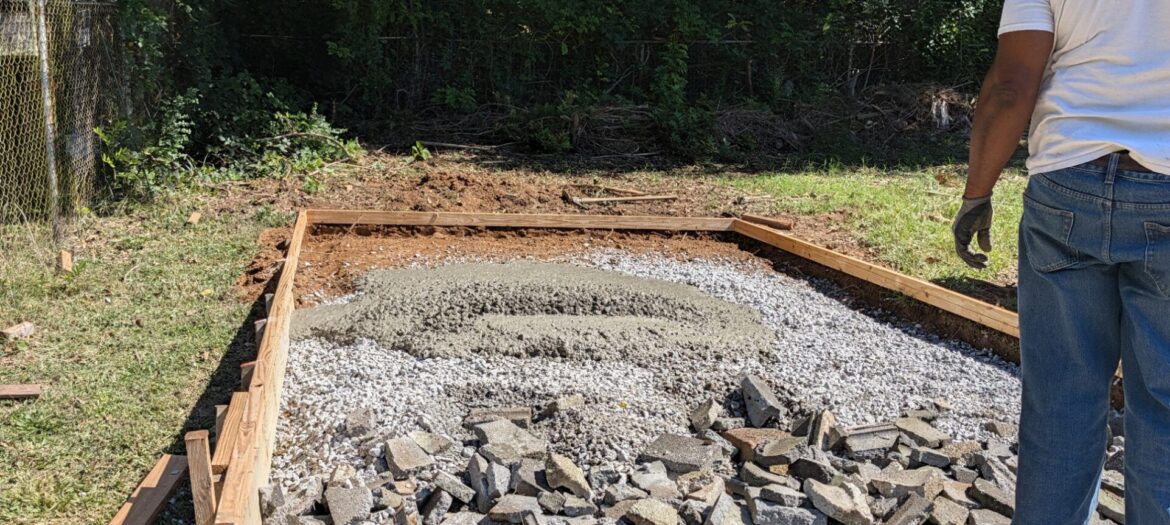 4.5 yard short load concrete pad pour in Austell, GA Fresh 3,000 PSI concrete placed on a gravel base inside wood forms for a backyard pad in Austell, Georgia